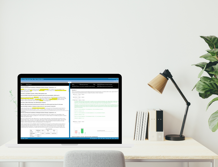 2025 MCAT interface updates Laptop with AAMC practice test on screen on top of desk next to books and table lamp